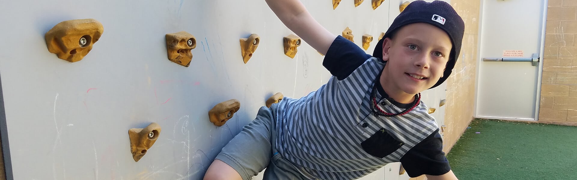 Boy climbing wall / Other ways to give image